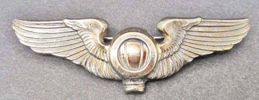 USAAF ARMY AIR FORCE BALLOON OBSERVER WING: Measures 3 3/16" wide by 1" tall. The reverse is maker marked: NS Meyer New York. Has a thin horizontal pin back with a locking catch. The wing is mounted on an NS Meyer New York card board card. One 