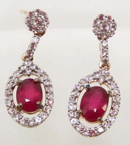 STERLING SILVER RUBY & SAPPHIRE EARRINGS: Comes w/ Appraisal of $1,140.00. Two Rubies 2.130 cts, 70 Sapphires 1.010 cts. Total Weight 3.820 grams.