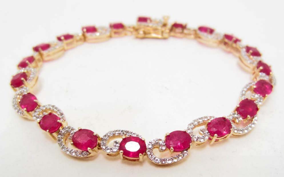GOLD OVER STERLING SILVER RUBY & SAPPHIRE BRACELET: Comes w/ Appraisal of $3,700.00. 20 Rubies 10.51 cts, 240 Sapphires 1.55 cts. Total Weight 12.30 grams.