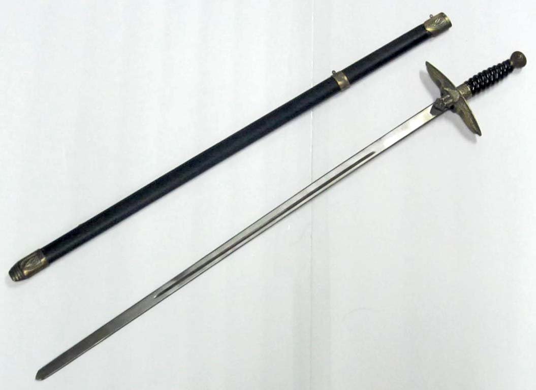 POST WAR GERMAN NAZI LUFTWAFFE OFFICERS SWORD W/: Measures 33" long overall. The steel blade measures 13/16" wide by 26 9/16" long. The black leather covered steel scabbard measures 1 1/8" wide by 27 ¾" long. Has three brass fittings attached. Has a