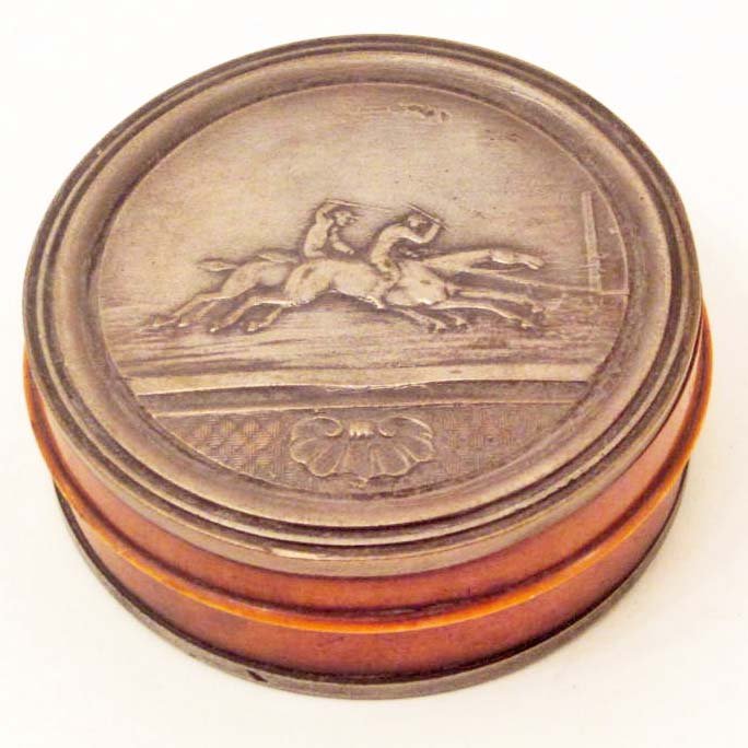 SNUFF BOX W/ SILVER EMBOSSED HORSE RACING LID: Bottom is silver also and engraved LONGFELLOW WINNER OF THE AMERICAN MONMOUTH CUP 1872. PRESENTED TO UNCLE JOHN HARPER FROM THE KENTUCKY GENTLEMENS ASSOCIATION 3RD SEPTEMBER 1872. Approx. 2.75" diamet