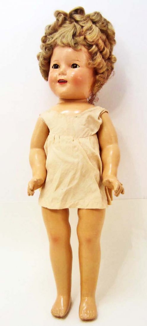 CIRCA 1930'S SHIRLEY TEMPLE 18" COMPOSITION DOLL: She has sleepy eyes, teeth showing and her arms, legs and head are strung together. She is in very good condition for her age and has all of her fingers and toes.