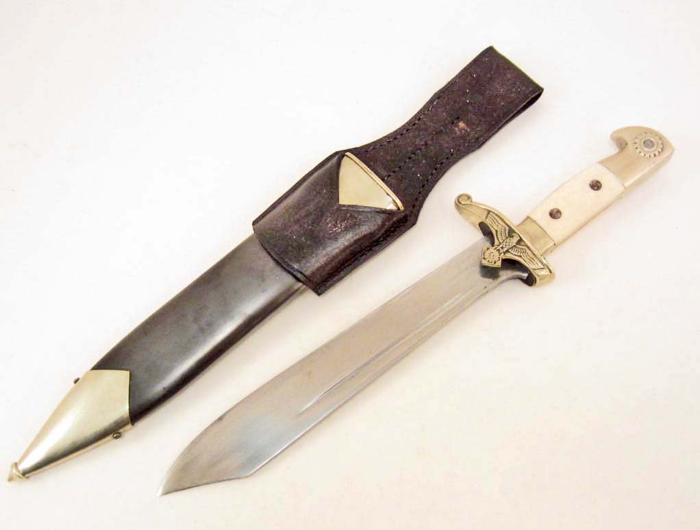 GERMAN NAZI TENO ENLISTED MANS DAGGER W/ SCABBARD: Measures 15 5/16" long overall. The steel blade is maker marked Original Eickhorn Solingen. The squirrel logo is in the center. Above is the Teno eagle with ges gesch below. It measures 1 1/2" wide by