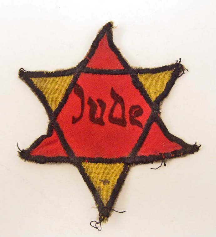 GERMAN NAZI JEWISH CONCENTRATION CAMP JUDE UNIFORM STAR: Measures 3 3/4" wide by 4 1/4" tall. Multi piece machine sewn cotton construction. This was to have been worn on the upper left breast of the stripped camp uniform. RARE.