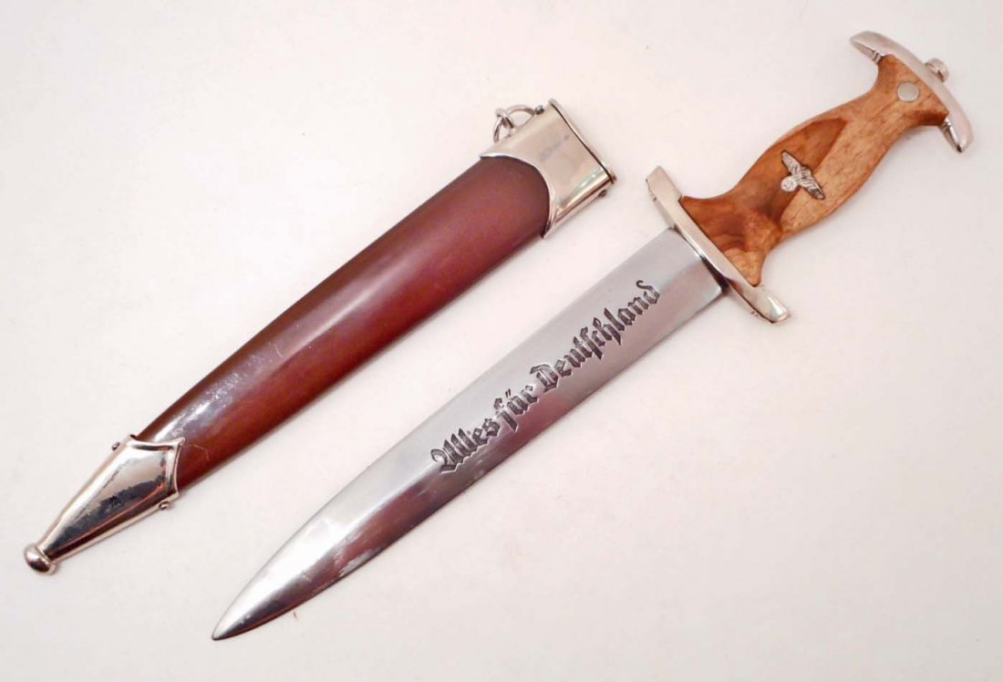 GERMAN NAZI SA STORM TROOPERS STURM ABTEILUNG EM DAGGER: Measures 14 3/4" long overall. The front of the etched steel blade reads Alles fur Deutschland (All for Germany). The reverse side is maker marked RZM M7/66 for the Carl Eickhorn Solingen manufacturin
