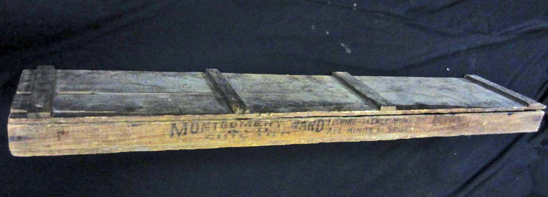 RARE ANTIQUE MONTGOMERY WARD WOOD GUN SHIPPING BOX: Approx. 47" by 9" by 3". Both long sides of the box are marked MONTGOMERY WARD & CO CHICAGO FISHING - TACKLE - GUNS - RIFLES - ALL KINDS OF SPORTING GOODS