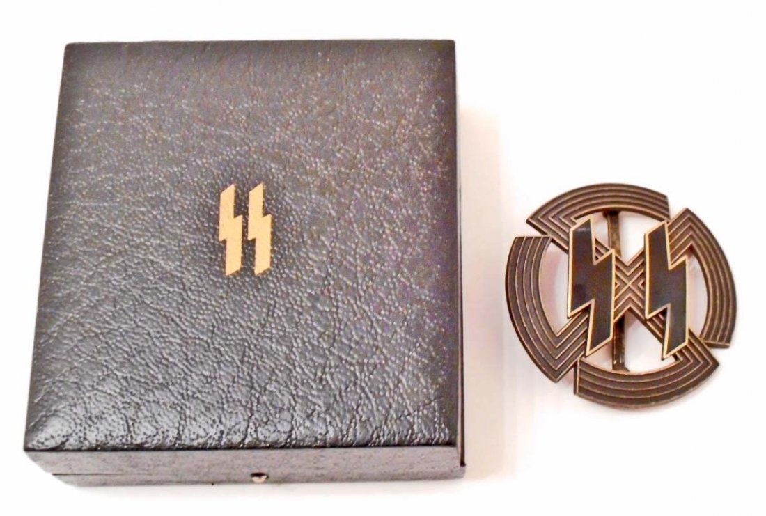 CASED GERMAN NAZI WAFFEN SS BRONZE RUNIC PROFICIENCY: Maker marked 'Richard Sieper & Sohne Ludenscheid RZM M1/25'. Has a wide vertical pin back. Includes the black leatherette presentation award case