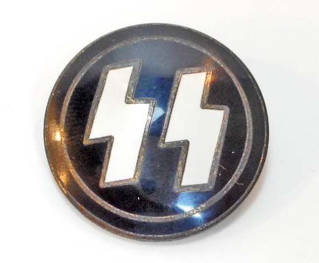 GERMAN NAZI WAFFEN SS ENAMELED RUNIC BADGE: Measures 1" in diameter. The reverse side is maker marked 'RZM M1/4 ges gesch'. Thin horizontal pin back. Nickel construction with enamel.
