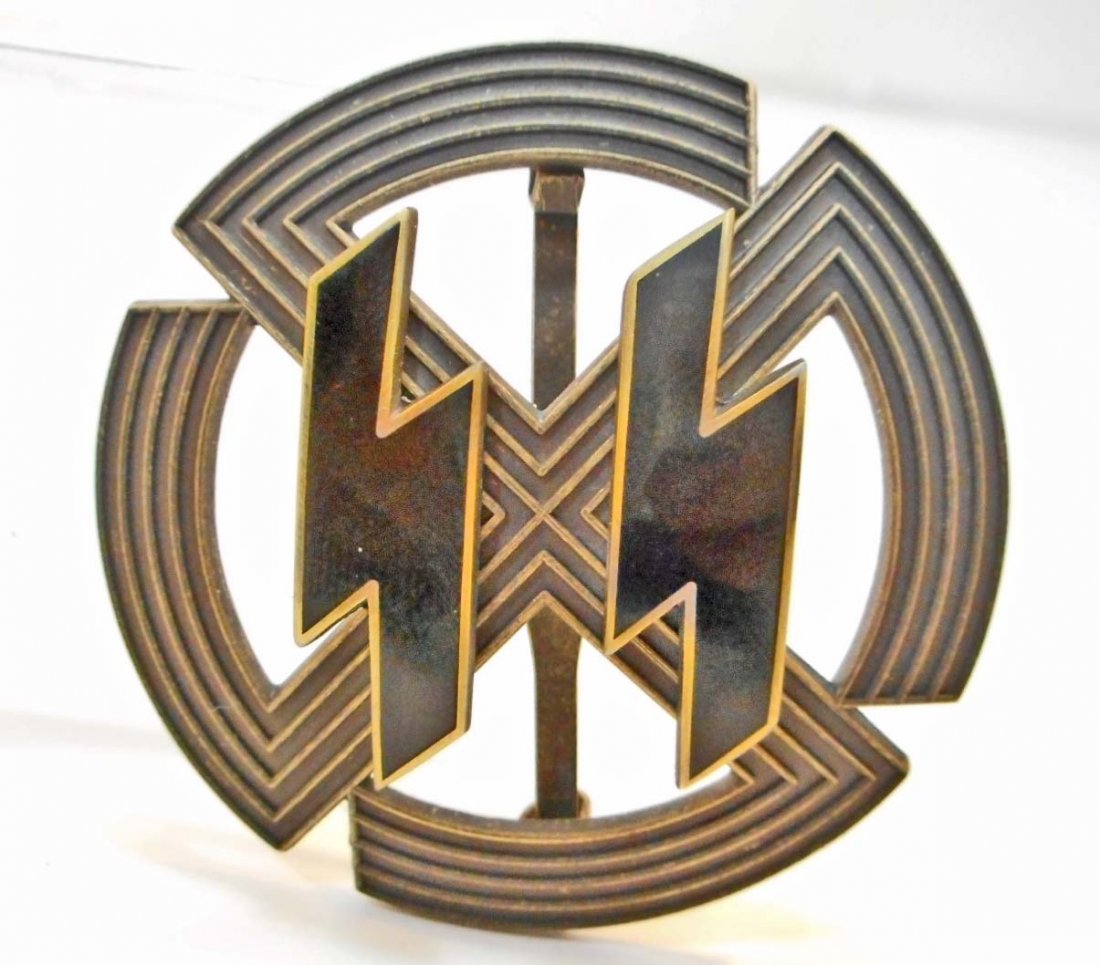 GERMAN NAZI BRONZE WAFFEN SS PROFICIENCY SPORTS BADGE: Measures 2" diameter. Reverse side is maker marked 'Richard Sieper & Sohne Ludenscheid RZM M1/25'. Wide vertical pin back. The badge is a cog wheel swastika. Three piece bronze construction with a pai