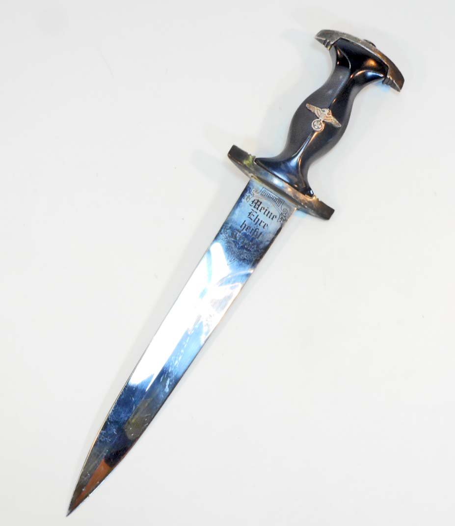POST WAR GERMAN NAZI WAFFEN SS STYLE DRESS DAGGER: Measures 11-15/16" long. The etched steel blade reads "Meine Ehre heisst Treue" (My Honor is Loyalty). It measures 1-3/16" wide and 7-7/8" long. The cross guards are nickel construction.