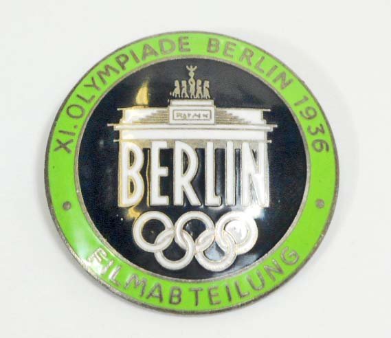 GERMAN NAZI BERLIN SUMMER OLYMPICS FILM MAKER BADGE: Measures 1 9/16" in diameter. The reverse side is maker marked 'Rob Neff Berlin W 57'. Has a thin horizontal pin back. Nickel construction with green enamel