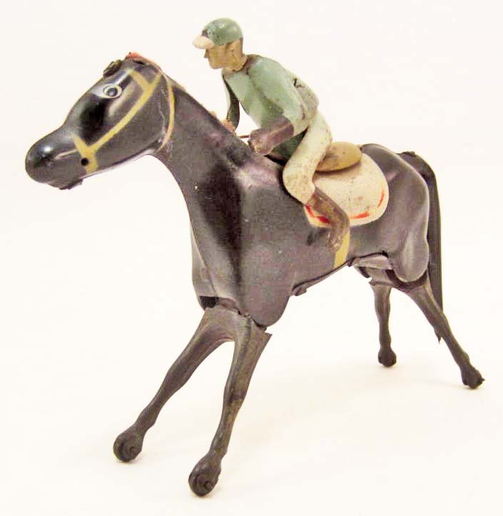 VINTAGE TIN LITHO WIND-UP TOY HORSE W/ JOCKEY - WORKS: Approx. 6" long. Bottom is marked Made in Spain.