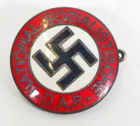 GERMAN NAZI NSDAP POLITICAL ENAMELED PARTY BADGE: Measures 1" in diameter. The reverse side is maker marked 'RZM M1/29'. Has a thin horizontal pin back. Nickel construction with enamel.