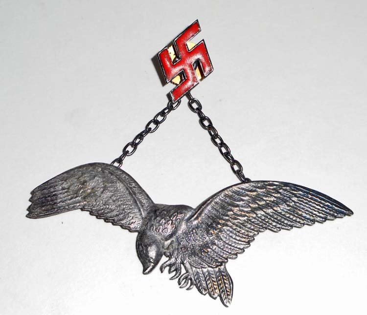 GERMAN NAZI HUNGARIAN LUFTWAFFE AXIS PILOT BADGE: The eagle measures 3 3/16" wide by 1 1/4" tll. Has a screw mount post and nut on the reverse side of the swastika. Nickel construction with red enamel.