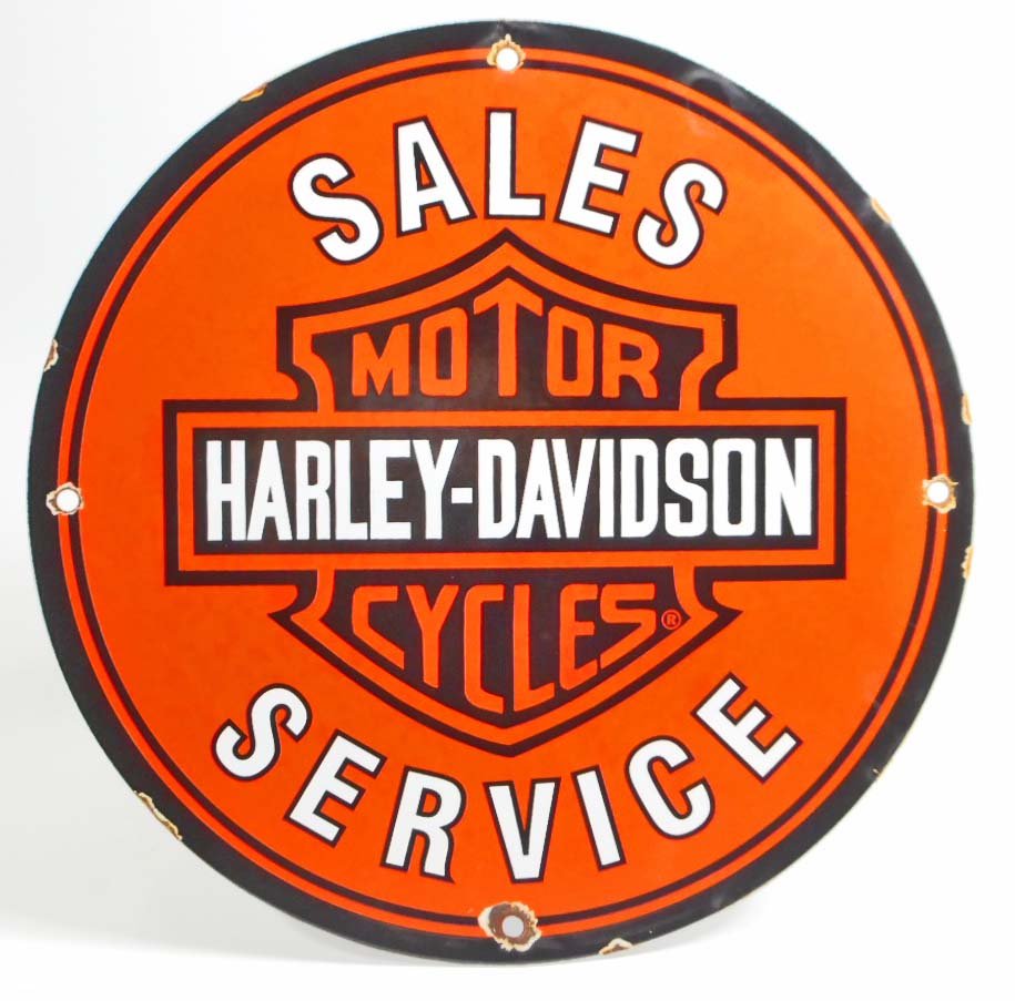 VINTAGE HARLEY DAVIDSON MOTORCYCLE PORCELAIN: Measures 11 3/4" in diameter. The front reads 'Sales Harley Davidson Motorcycle Service. Has four mounting holes that are chipped and rusted. Has smooth porcelain on both sides. Perfect for a 'Man Cav