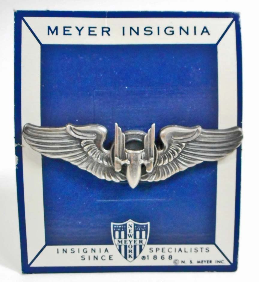 USAAF ARMY AIR FORCE AERIAL GUNNER WING: Measures 3 3/16" wide by 1" tall. The reverse side is maker marked 'Meyer New York' in their shield logo. It is also marked 'Sterling'. Has a thin horizontal pin back. Two piece silver construction. M