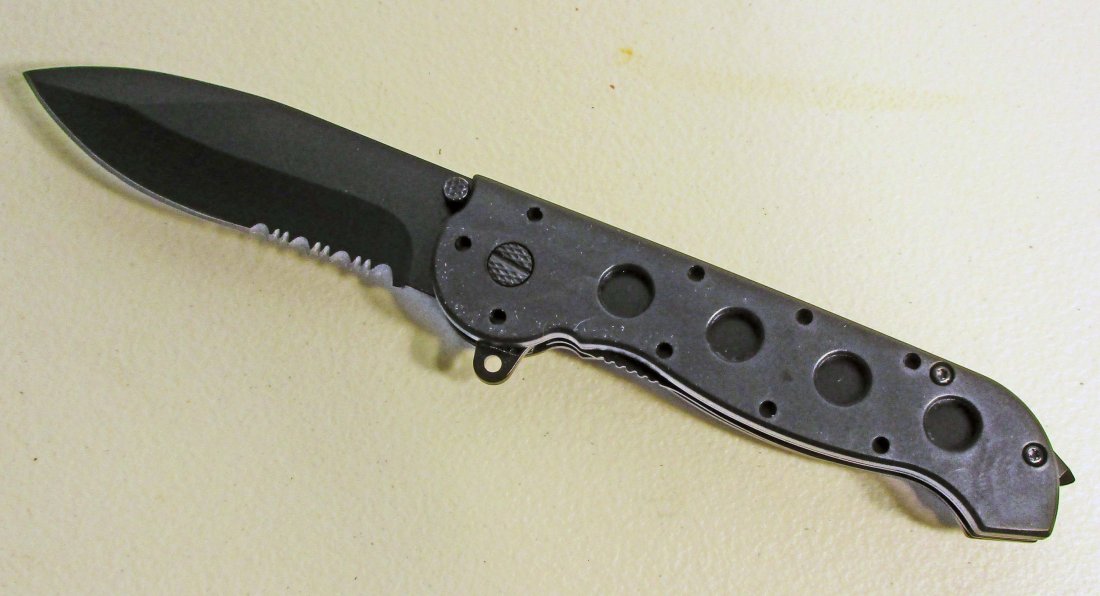 BLACK SPRING ASSISTED FOLDING KNIFE: Approx. 8" long opened