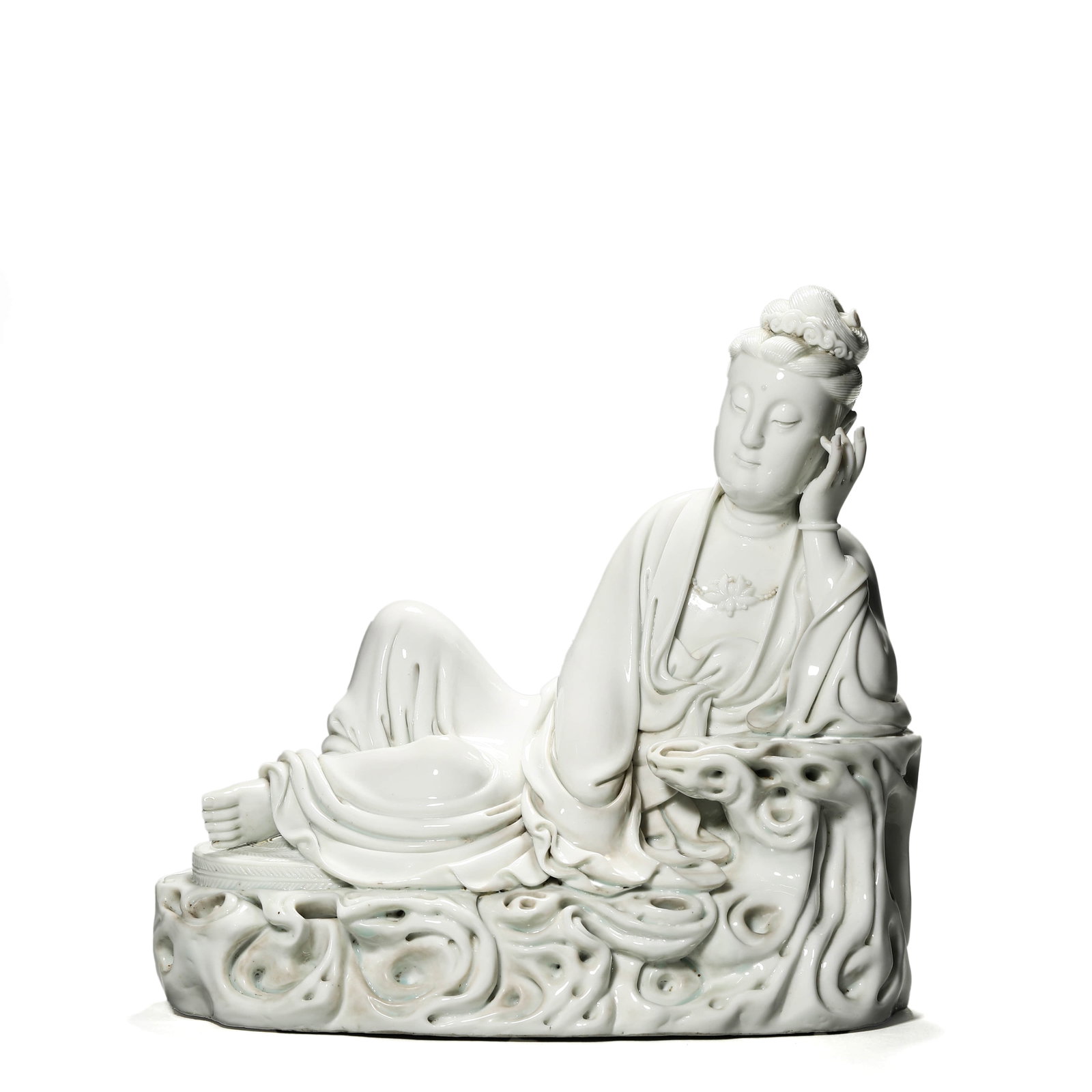 A WHITE PORCELAIN GUANYIN FIGURE: A WHITE PORCELAIN GUANYIN FIGURE Length: 9 5/8 in. (24.5 cm), Height: 9 1/4 in. (23.5 cm)