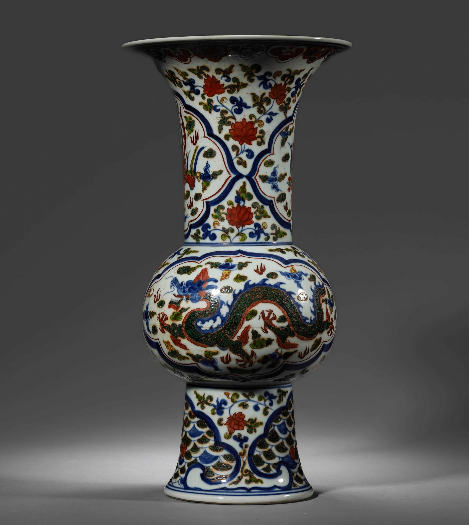 A WUCAI 'DRAGON' GU VASE: A WUCAI 'DRAGON' GU VASE Height: 13 3/8 in. (34 cm), Diameter: 6 7/8 in. (17.5 cm)