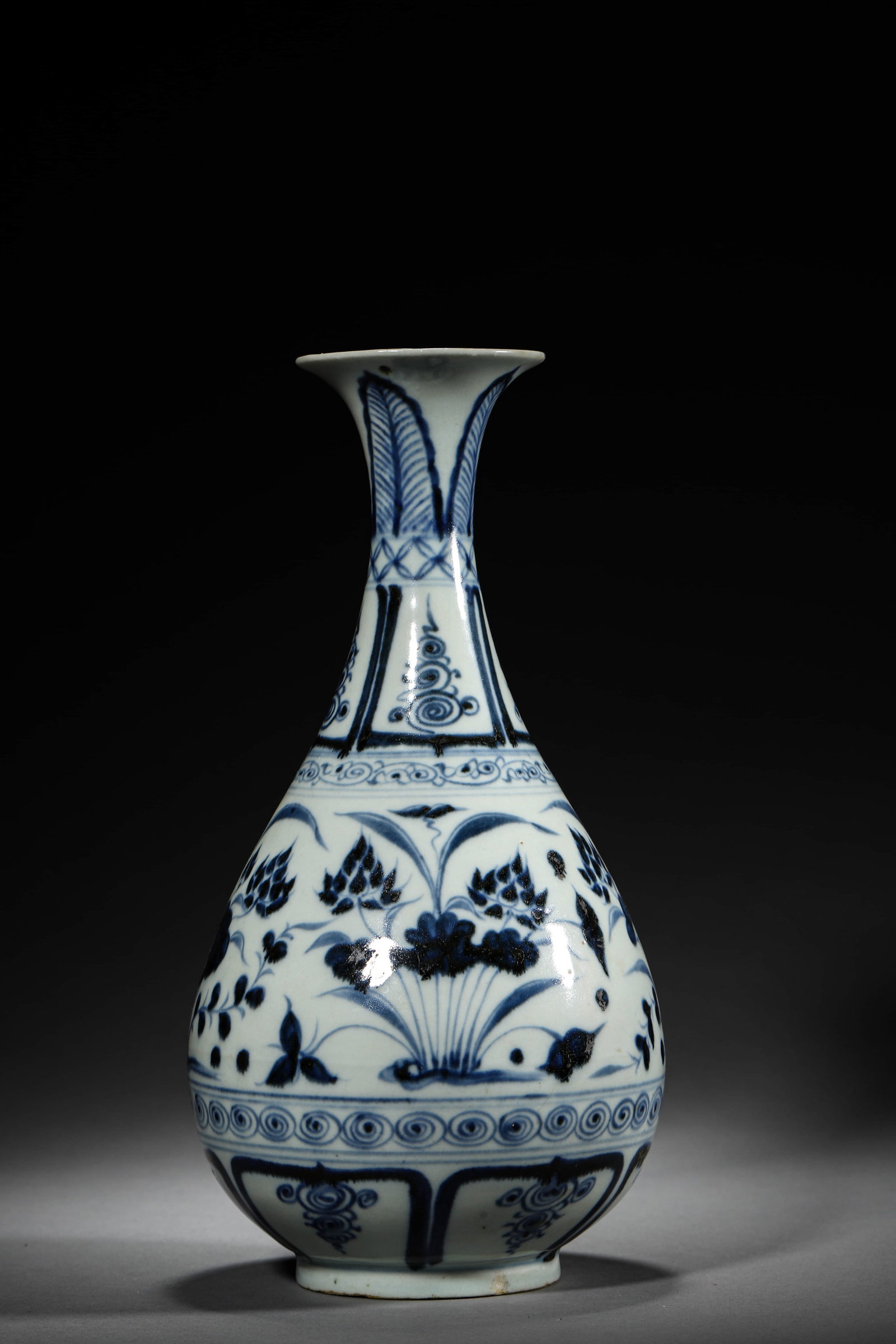 A BLUE AND WHITE 'LOTUS' YUHUCHUNPING: A BLUE AND WHITE 'LOTUS' YUHUCHUNPING Height: 11 in. (28 cm), Diameter: 5 1/2 in. (14 cm)