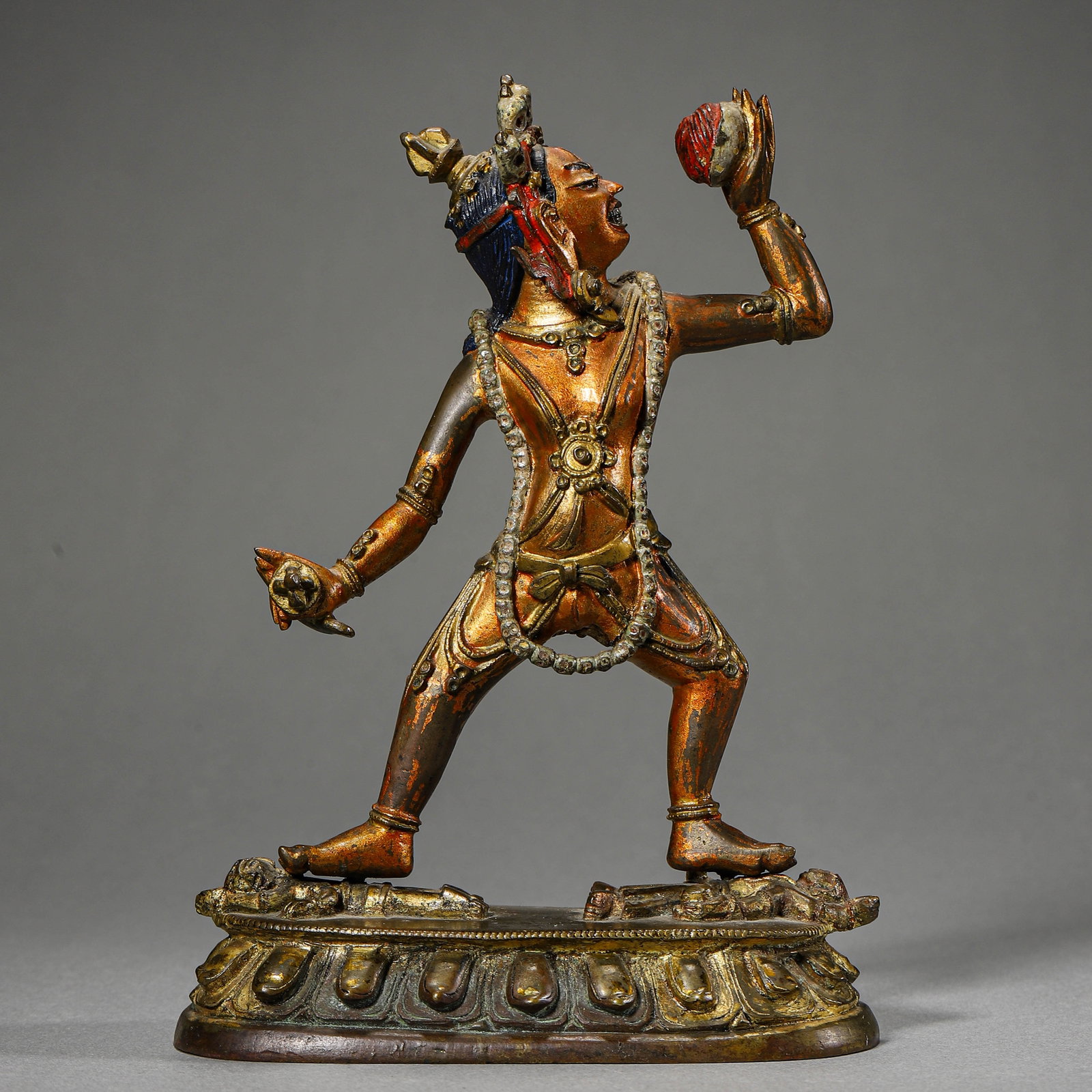 A TIBETAN-STYLE RED COPPER DHARMAPALA FIGURE: A TIBETAN-STYLE RED COPPER DHARMAPALA FIGURE Height: 6 1/2 in. (16.5 cm)