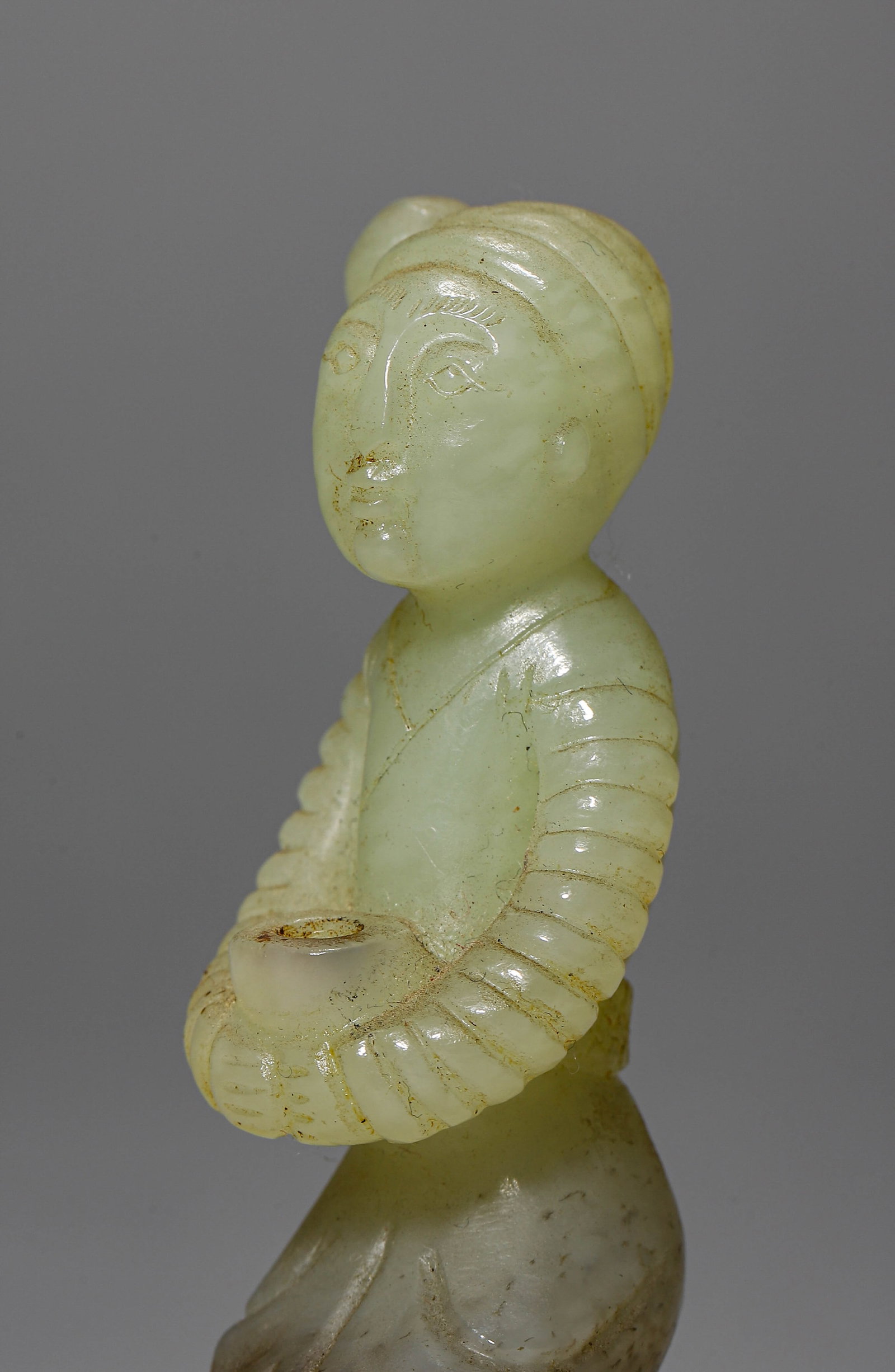 A JADE KNEELING FIGURE - 3