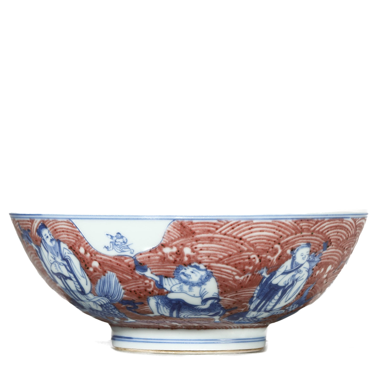 AN IRON-RED 'IMMORTALS CELEBRATING LONGEVITY' BOWL: AN IRON-RED 'IMMORTALS CELEBRATING LONGEVITY' BOWL Diameter: 8 1/2 in. (21.5 cm), Height: 3 1/8 in. (8 cm)