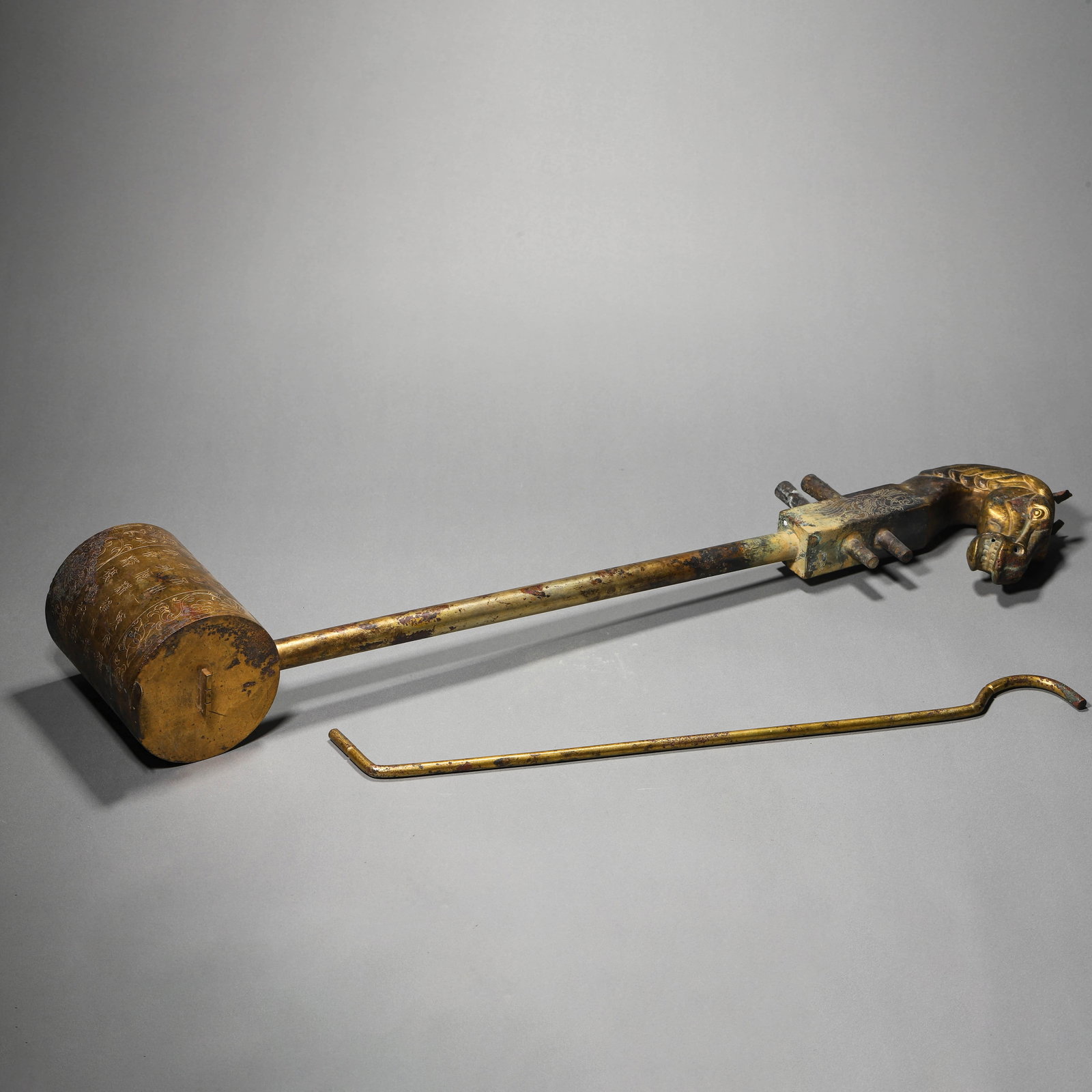 A GILT-BRONZE HORSEHEAD QIN: A GILT-BRONZE HORSEHEAD QIN Length: 27 15/16 in. (71 cm)