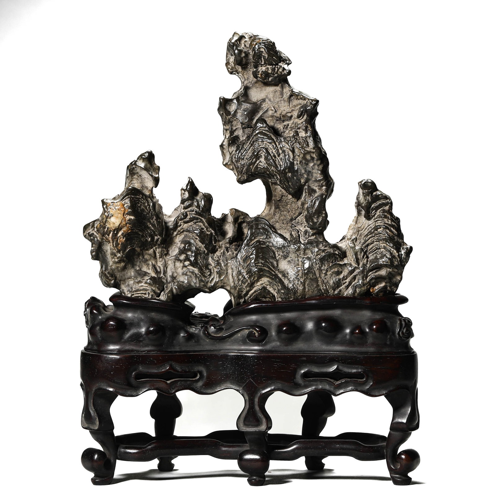 A TAIHU SCHOLAR'S ROCK: A TAIHU SCHOLAR'S ROCK Height: 12 in. (30.5 cm), Height: 7 1/16 in. (18 cm), Length: 8 1/2 in. (21.5 cm)