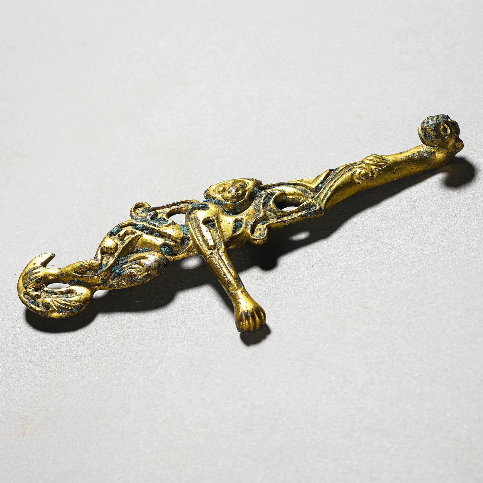 A GILT-BRONZE 'MONKEY' BELT HOOK: A GILT-BRONZE 'MONKEY' BELT HOOK Height: 5 1/8 in. (13 cm)
