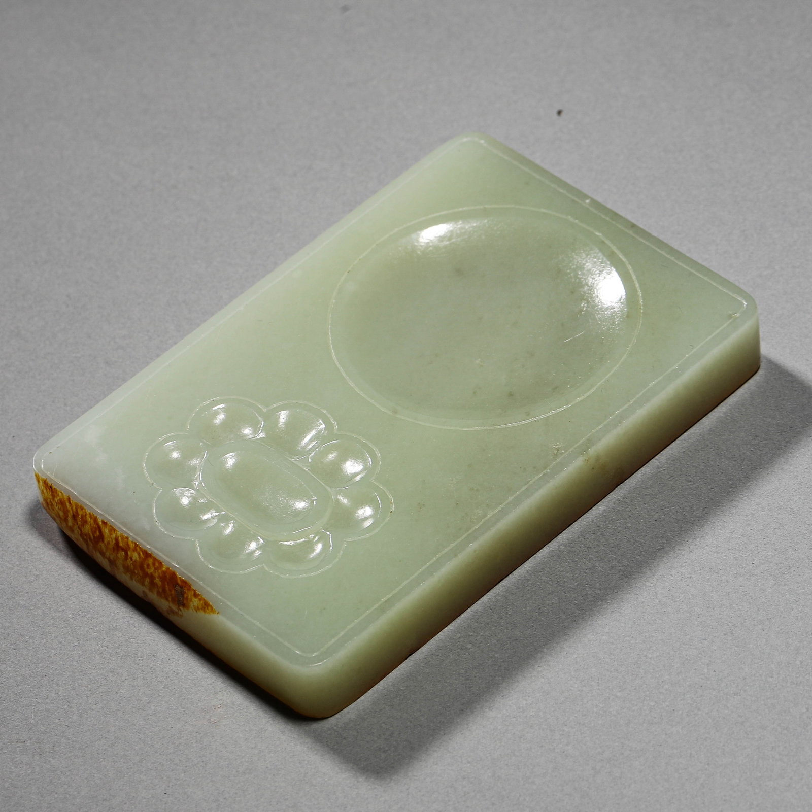 A WHITE JADE INKSTONE: A WHITE JADE INKSTONE Length: 4 1/2 in. (11.5 cm), Width: 3 in. (7.5 cm)