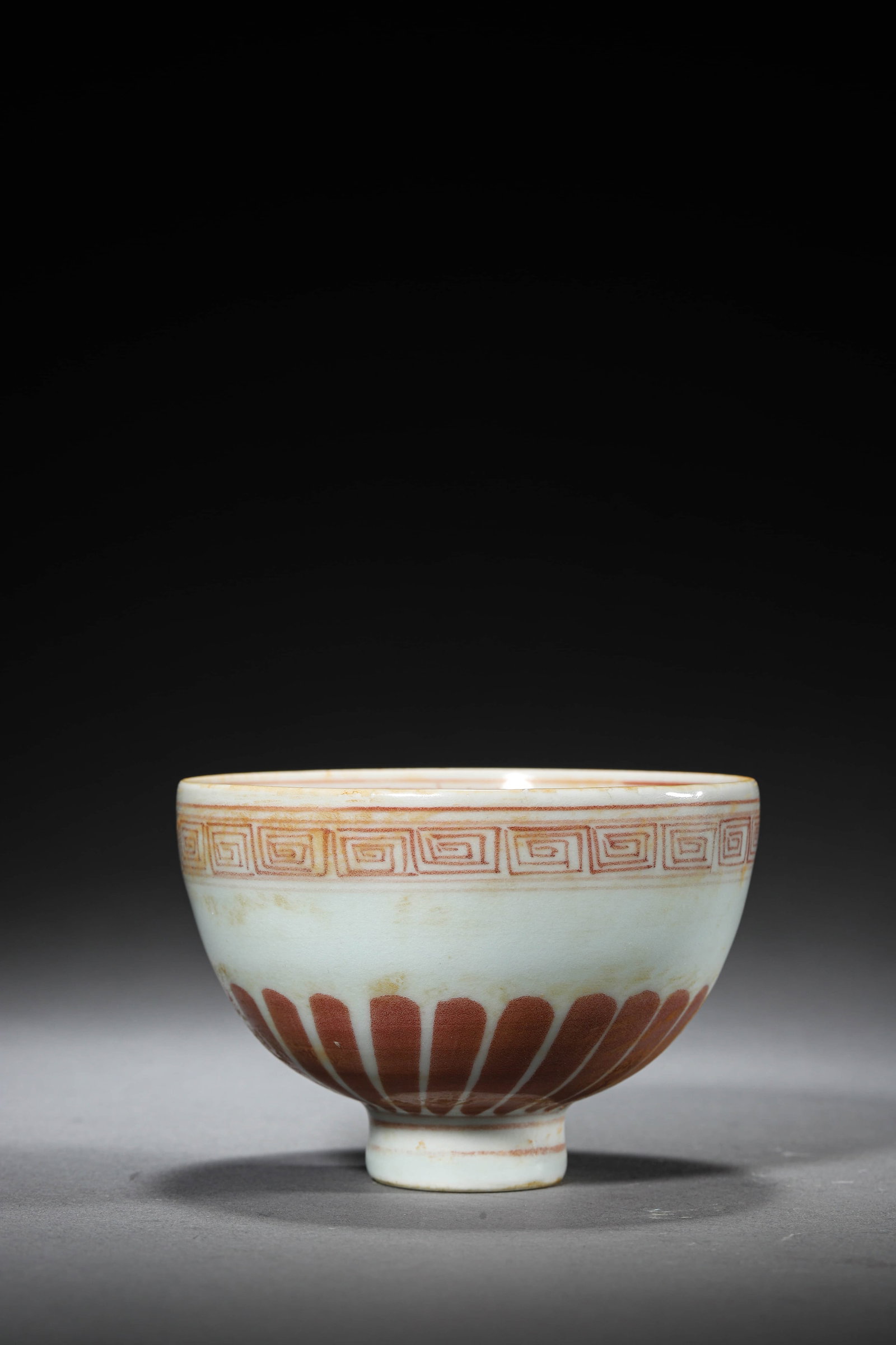 AN UNDERGLAZE-RED MEDALLION 'FLOWERS AND LOTUS PETAL' CUP: AN UNDERGLAZE-RED MEDALLION 'FLOWERS AND LOTUS PETAL' CUP Height: 2 7/8 in. (7.3 cm), Diameter: 4 1/8 in. (10.5 cm)