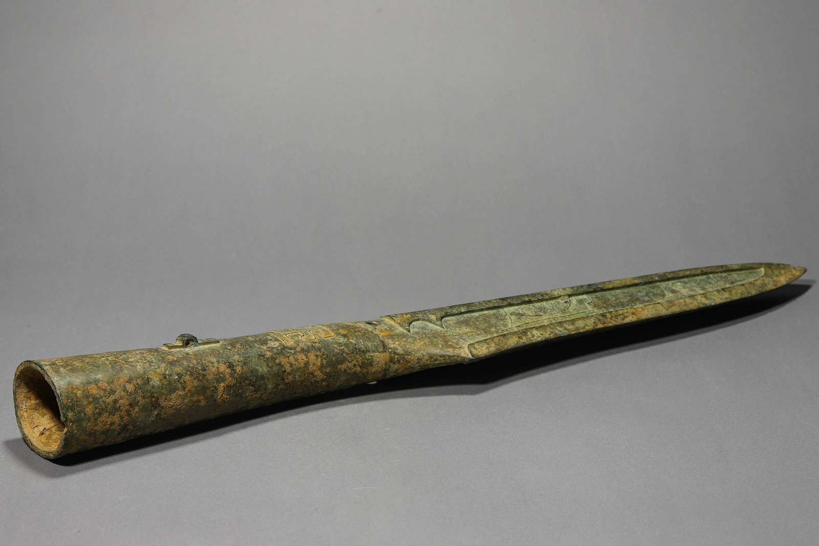 A BRONZE GUN HEAD - 7