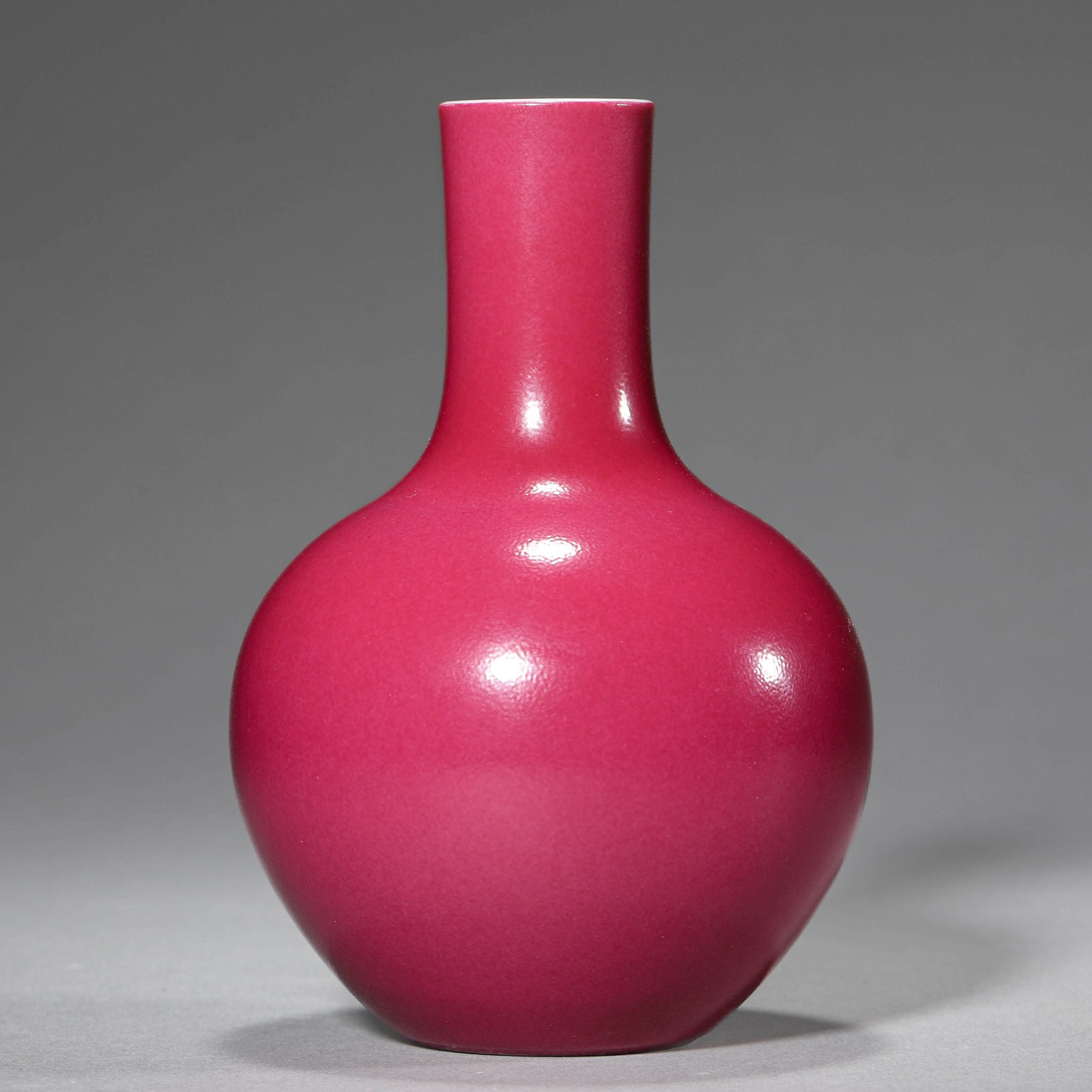 A RUBY-GLAZED SMALL GLOBULAR VASE: A RUBY-GLAZED SMALL GLOBULAR VASE Height: 4 3/4 in. (12 cm)