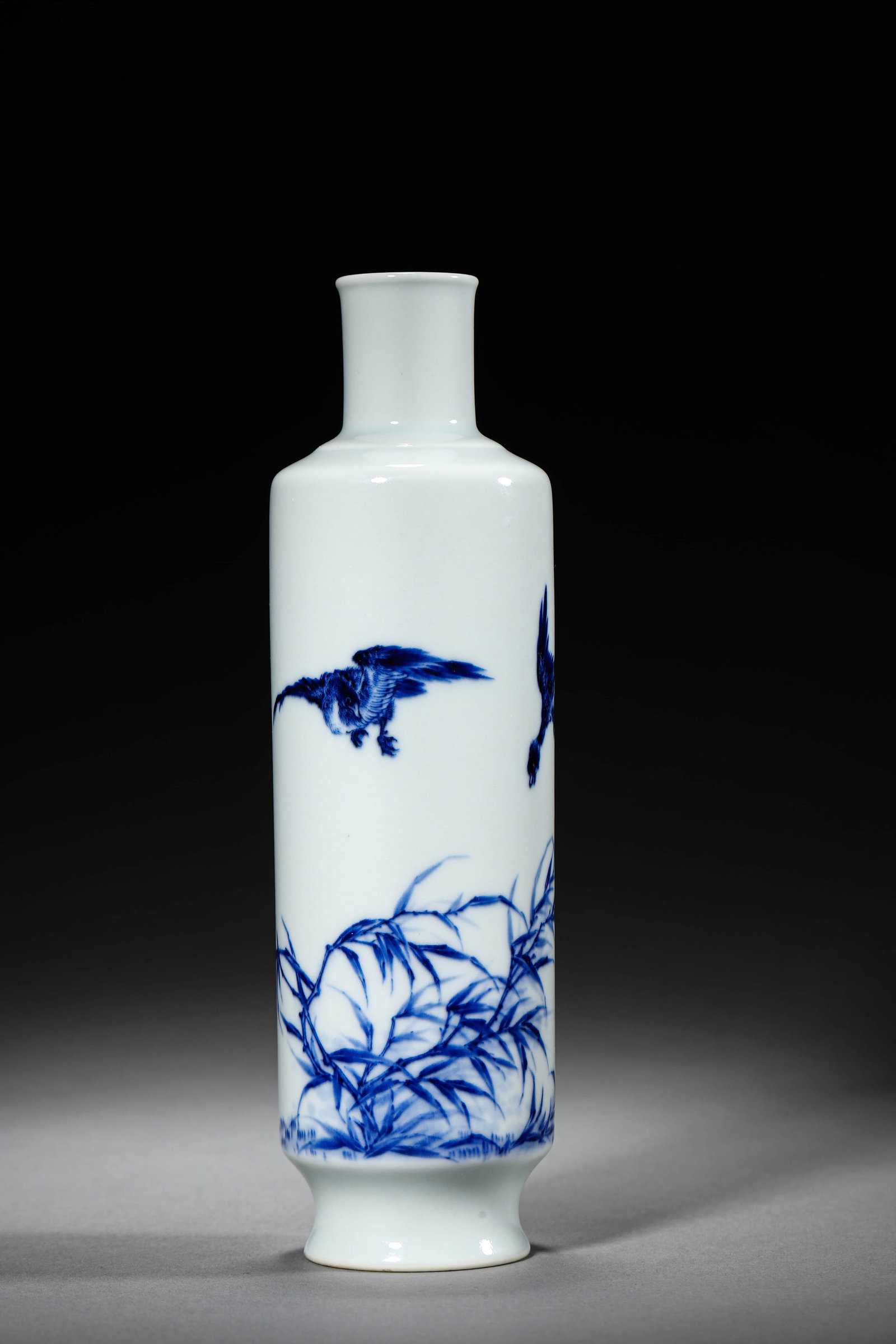 A BLUE AND WHITE 'LOTUS POND' VASE: A BLUE AND WHITE 'LOTUS POND' VASE Height: 8 5/8 in. (22 cm), Diameter: 2 3/8 in. (6 cm)