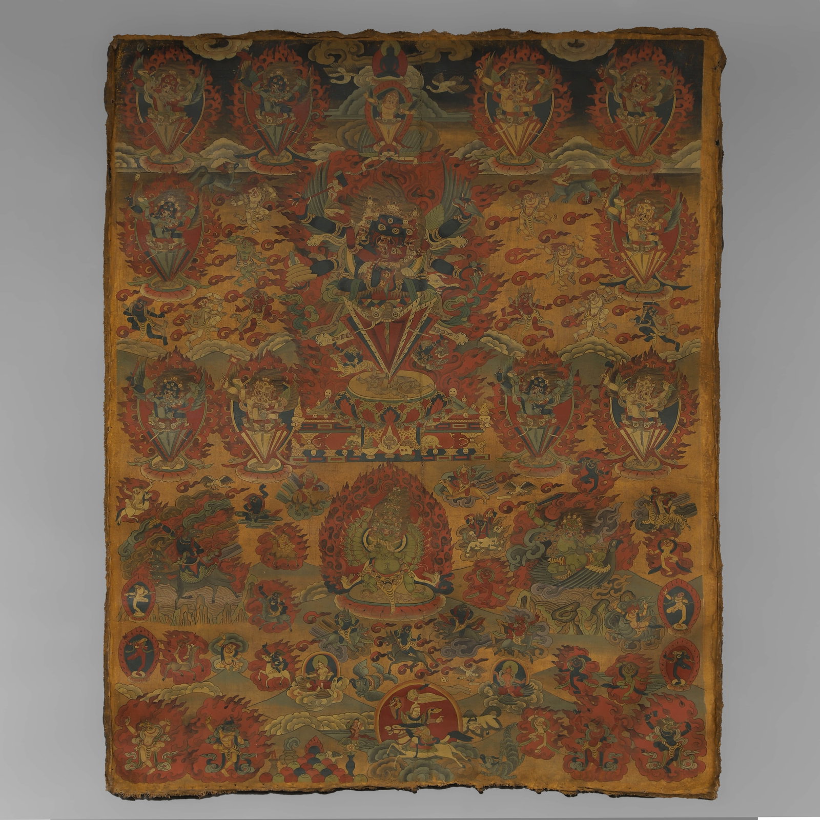 A TIBETAN THANGKA: A TIBETAN THANGKA Length: 50 3/8 in. (128 cm), Width: 40 1/8 in. (102 cm)