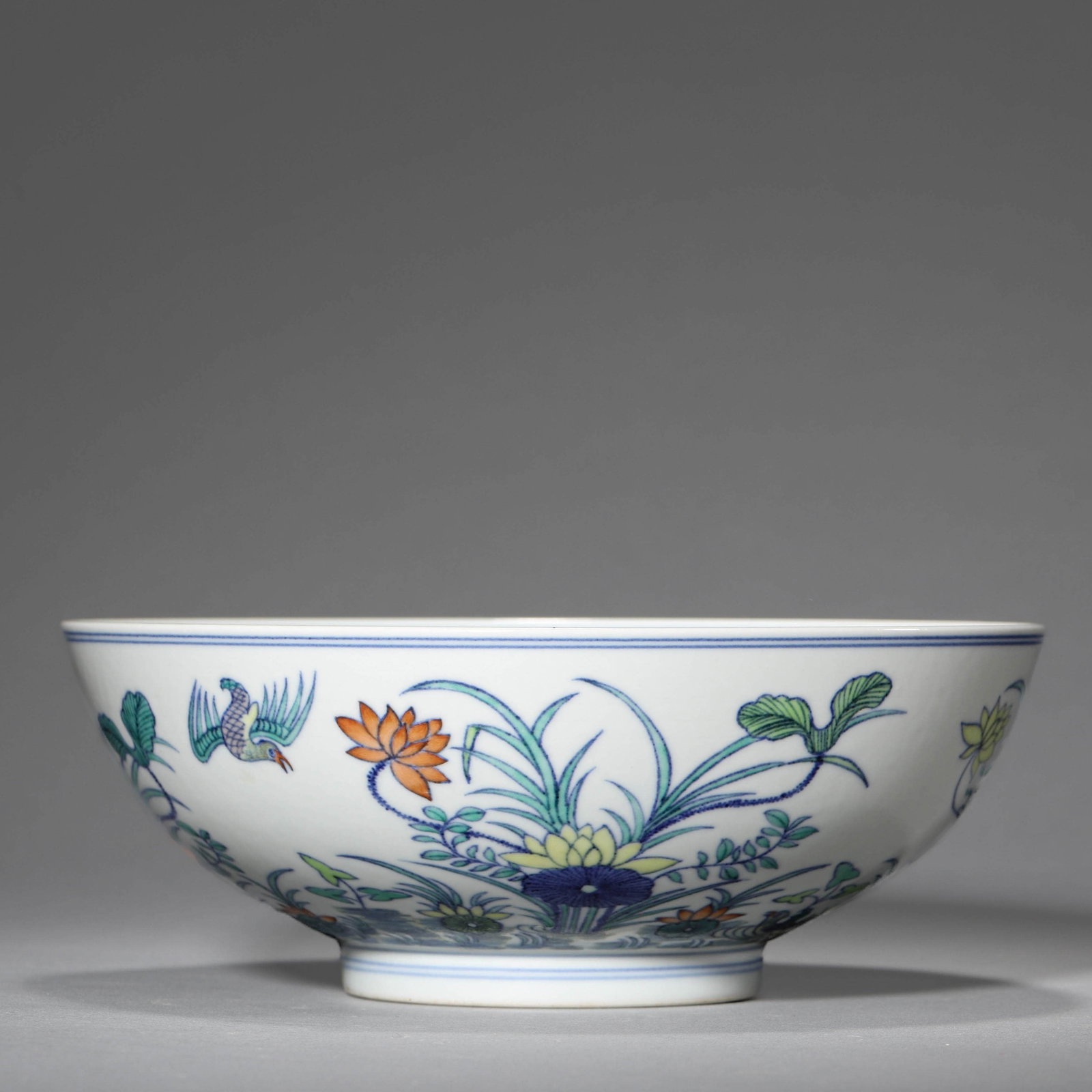 A DOUCAI 'LOTUS POND' BOWL: A DOUCAI 'LOTUS POND' BOWL Diameter: 8 in. (20.5 cm), Height: 3 1/2 in. (9 cm)