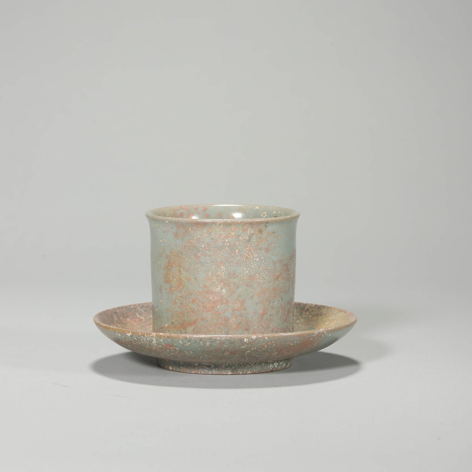 A TEACUP AND SAUCER SET: A TEACUP AND SAUCER SET Height: 2 1/2 in. (6.3 cm), Diameter: 2 13/16 in. (7.2 cm), Diameter: 4 15/16 in. (12.5 cm)