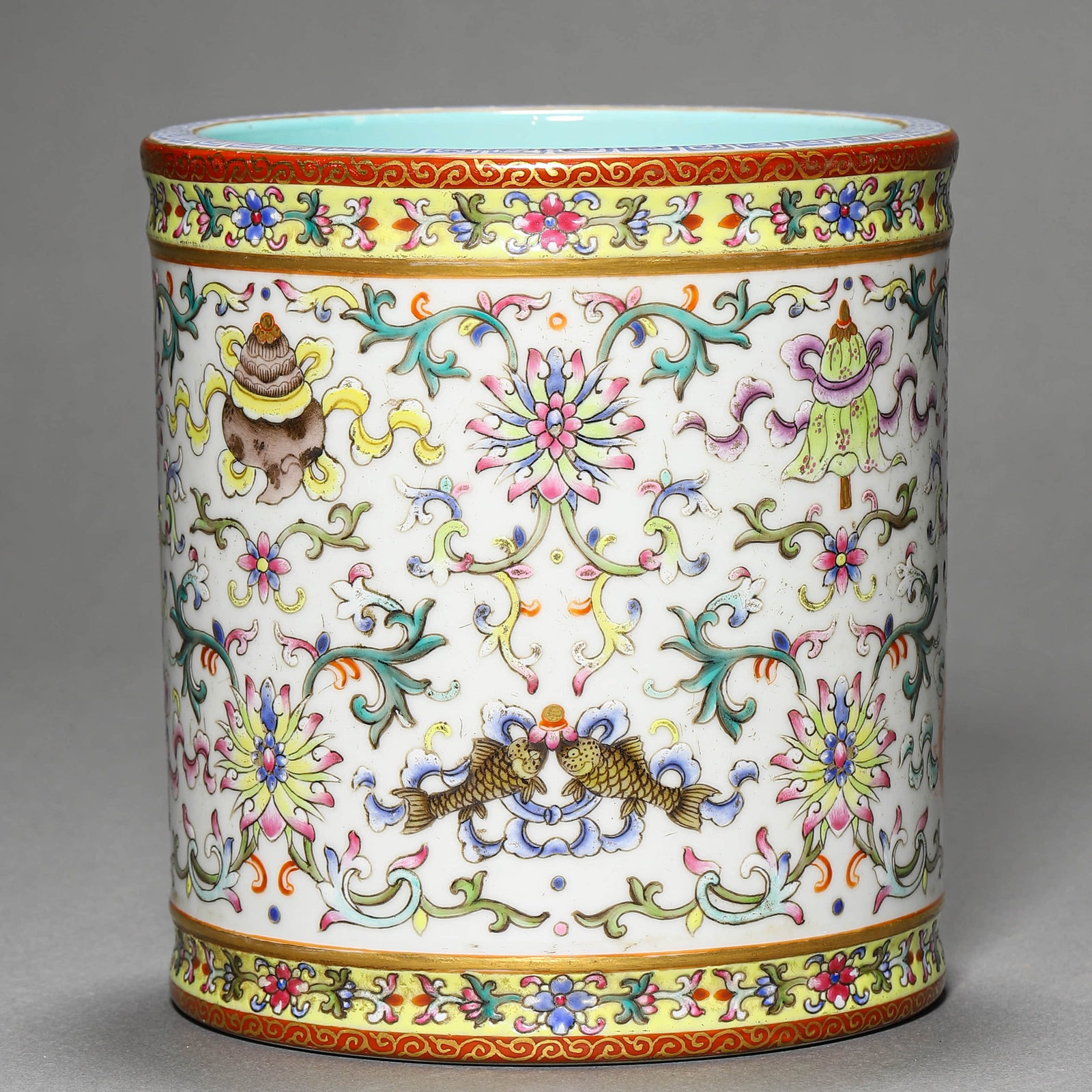 A FAMILLE ROSE 'EIGHT TREASURES' BRUSH POT: A FAMILLE ROSE 'EIGHT TREASURES' BRUSH POT Height: 5 1/2 in. (14 cm), Diameter: 5 1/8 in. (13 cm)