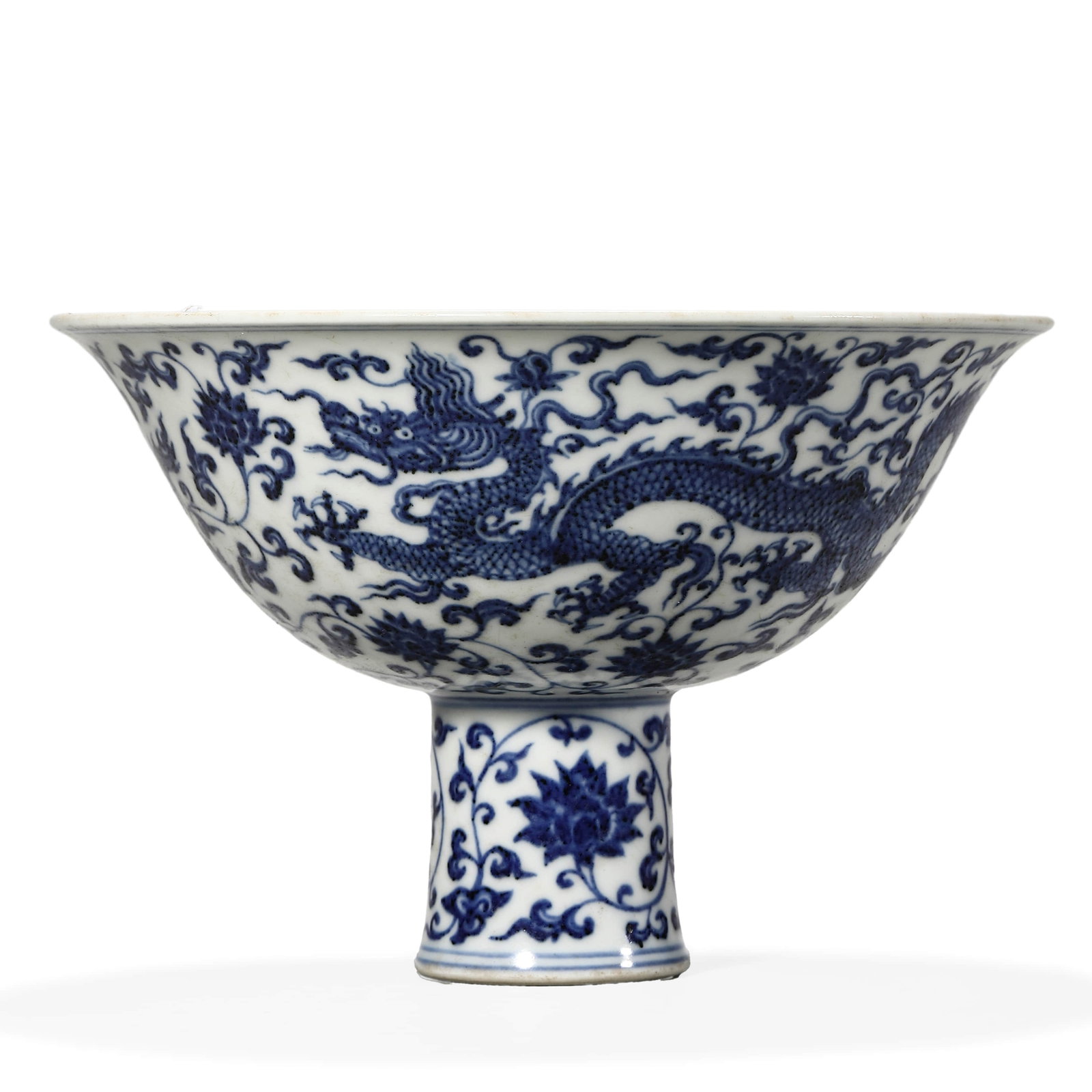 A BLUE AND WHITE 'DRAGON' STEM BOWL: A BLUE AND WHITE 'DRAGON' STEM BOWL Height: 4 1/2 in. (11.5 cm), Diameter: 6 7/8 in. (17.5 cm)