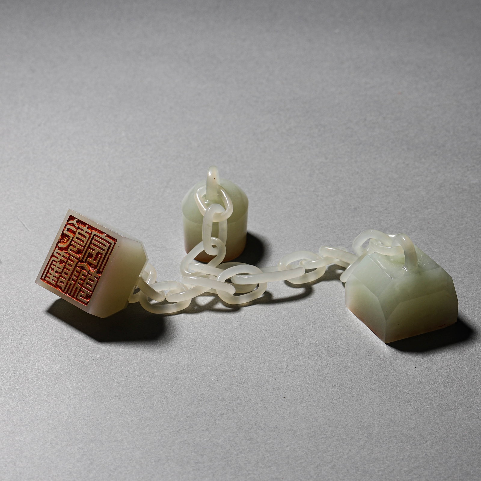 A WHITE JADE CHAINED TRIPLE SEAL - 2