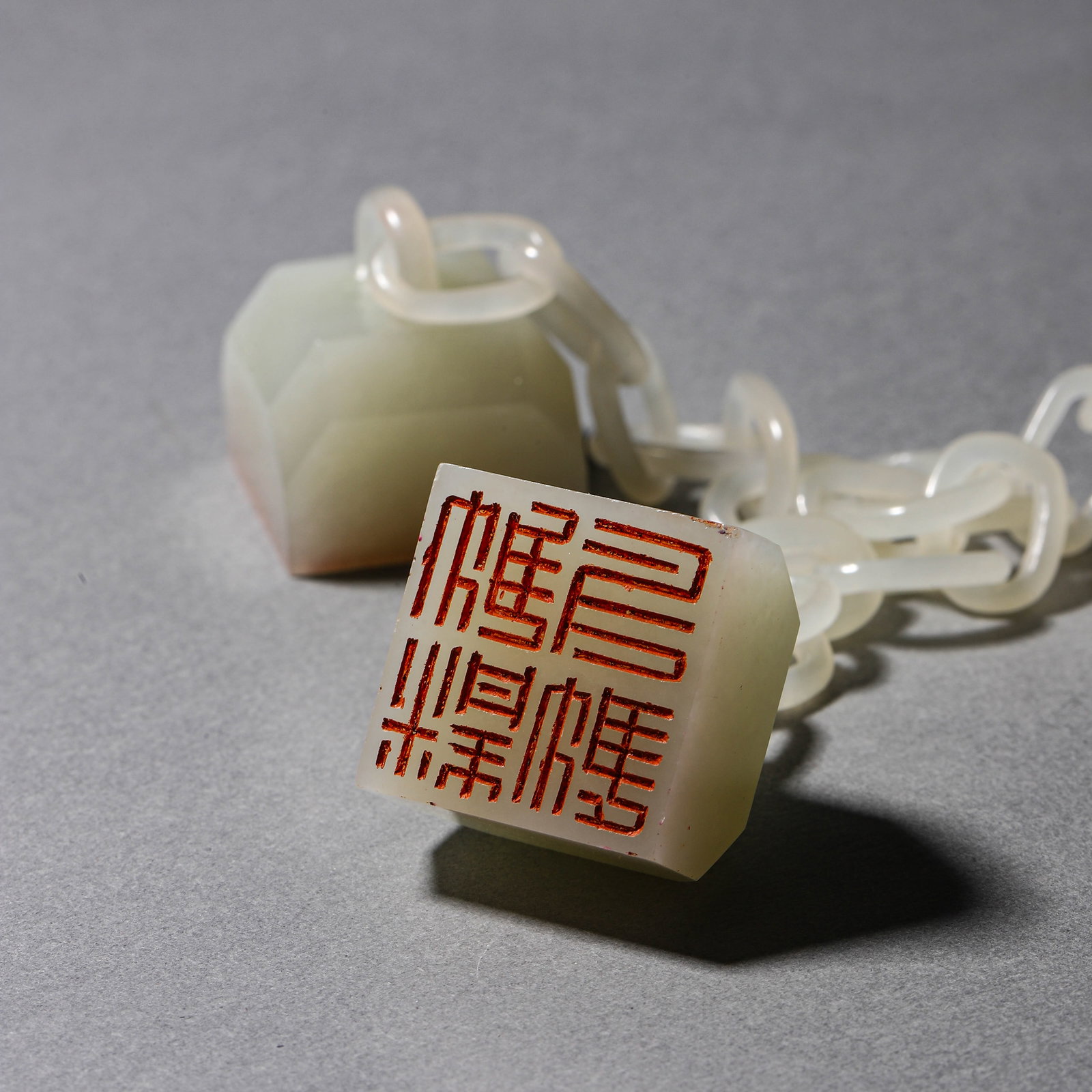 A WHITE JADE CHAINED TRIPLE SEAL - 5