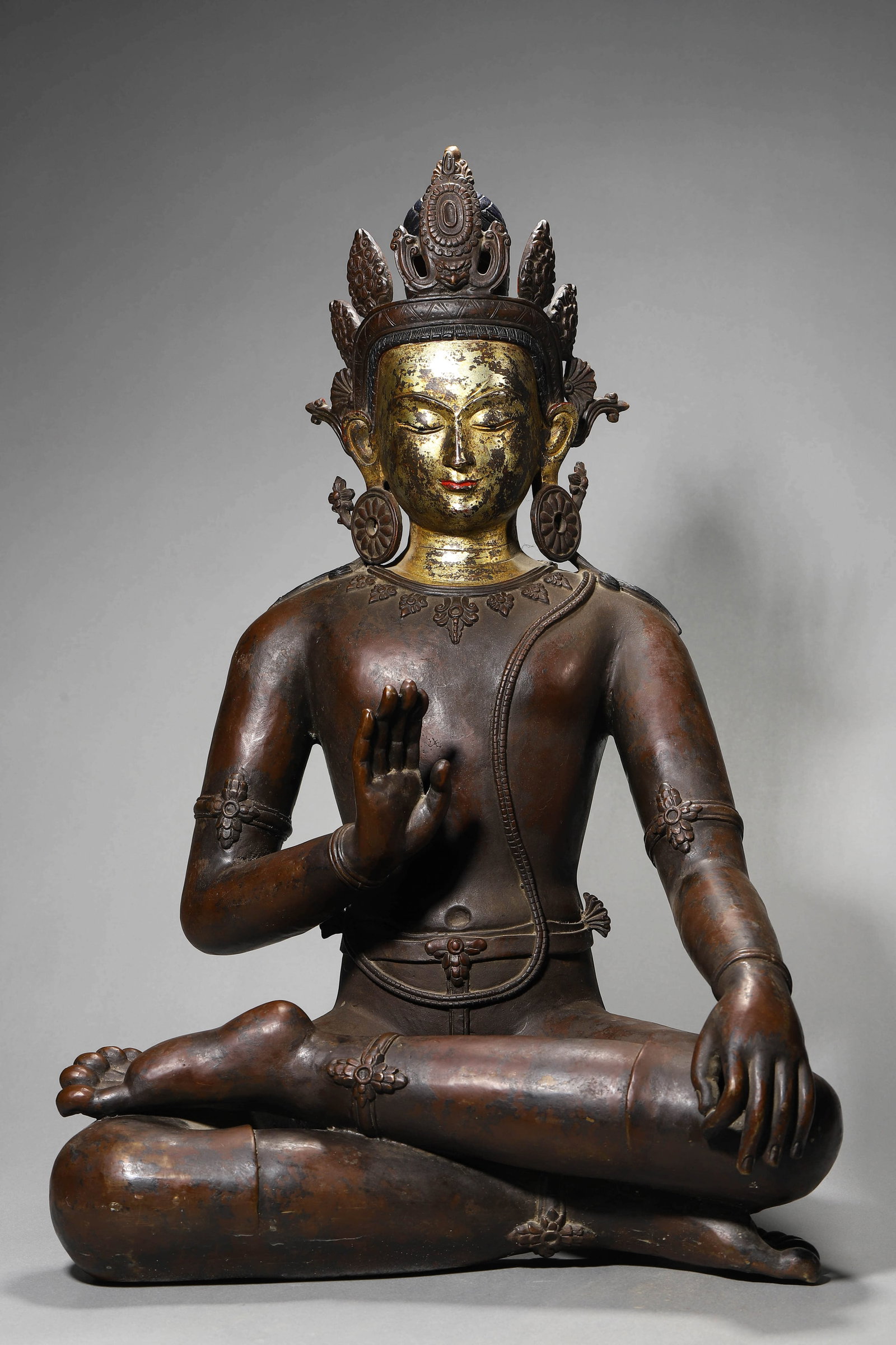 A BRONZE TIBETAN MOTHER FIGURE: A BRONZE TIBETAN MOTHER FIGURE Height: 22 7/8 in. (58 cm)