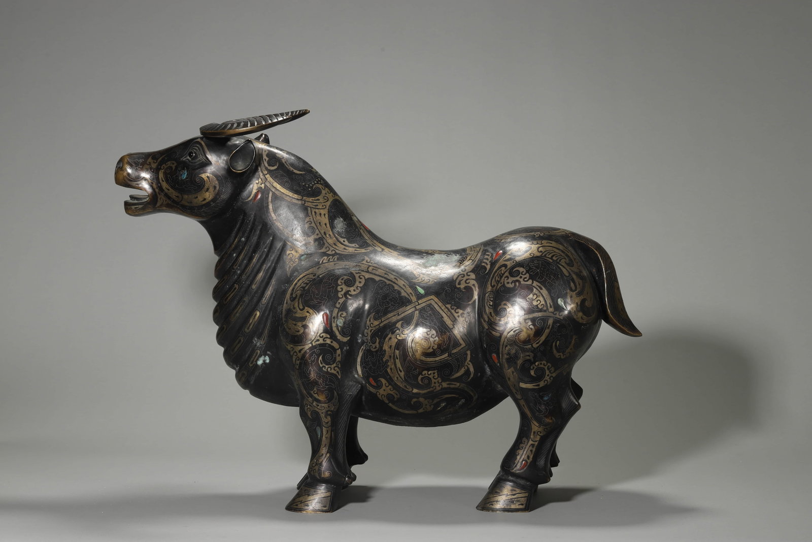 A GOLD AND SILVER-INLAID BEAST: A GOLD AND SILVER-INLAID BEAST Length: 16 15/16 in. (43 cm), Height: 22 13/16 in. (58 cm)