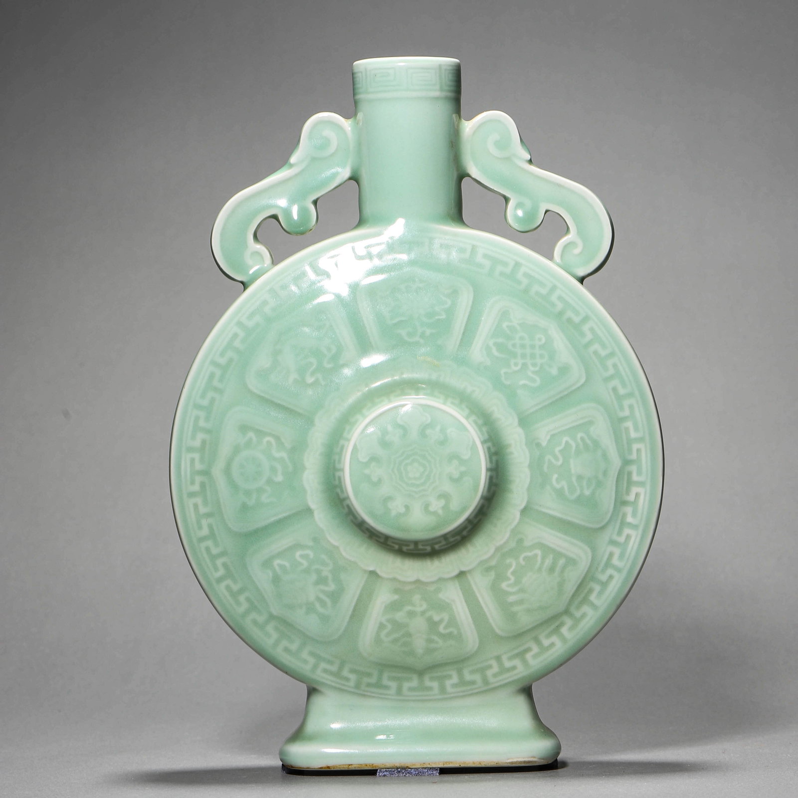 A CELADON-GLAZED 'EIGHT TREASURES' MOONFLASK: A CELADON-GLAZED 'EIGHT TREASURES' MOONFLASK Height: 10 5/8 in. (27 cm)