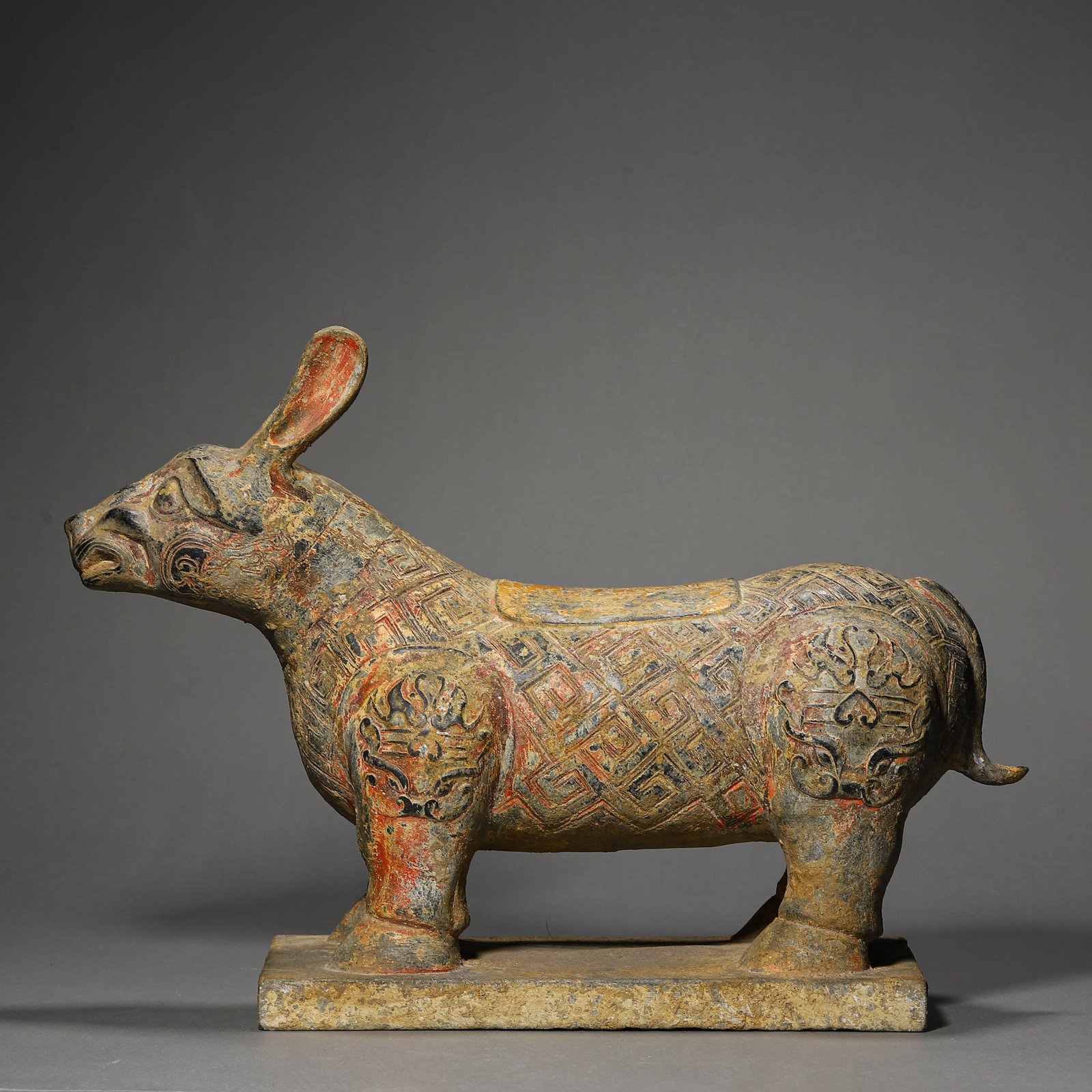 A STONE-CARVED MYTHICAL BEAST FIGURE: A STONE-CARVED MYTHICAL BEAST FIGURE Length: 15 3/8 in. (39 cm), Width: 11 in. (28 cm)
