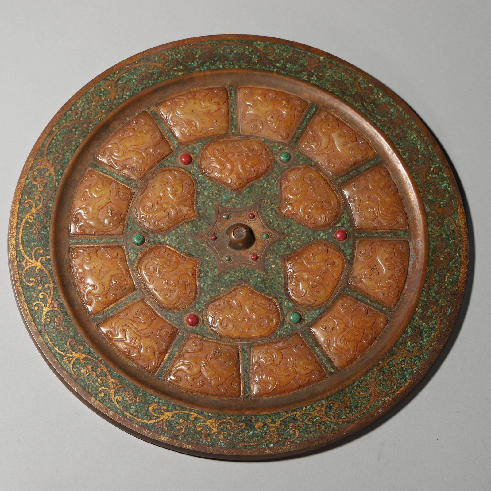 A GILT-BRONZE AND JADE-INSET 'DRAGON' MIRROR (1 of 6)