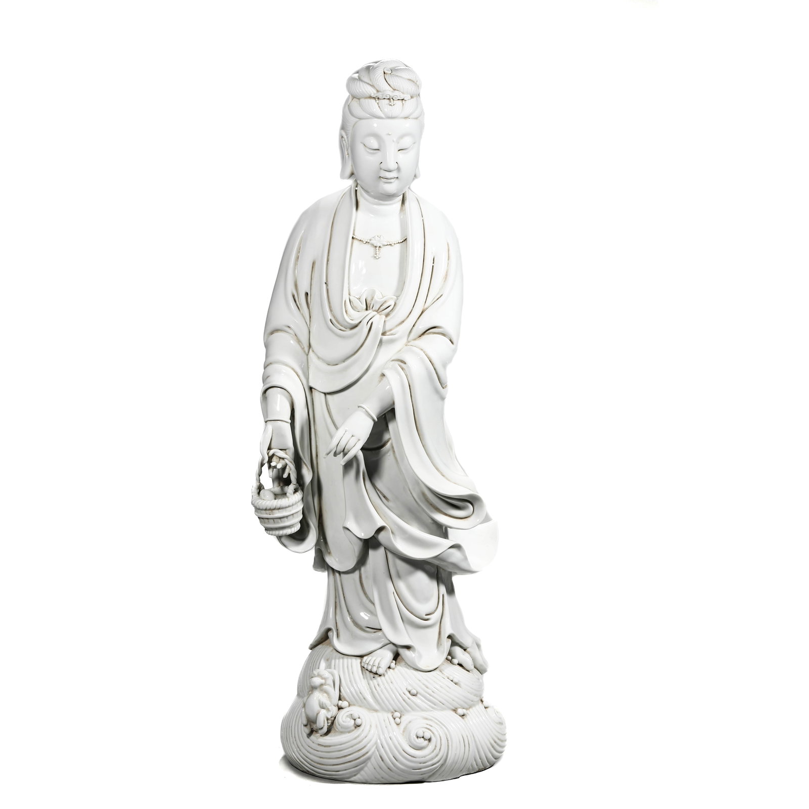 A DEHUA WARE GUANYIN FIGURE: A DEHUA WARE GUANYIN FIGURE Height: 28 3/4 in. (73 cm)