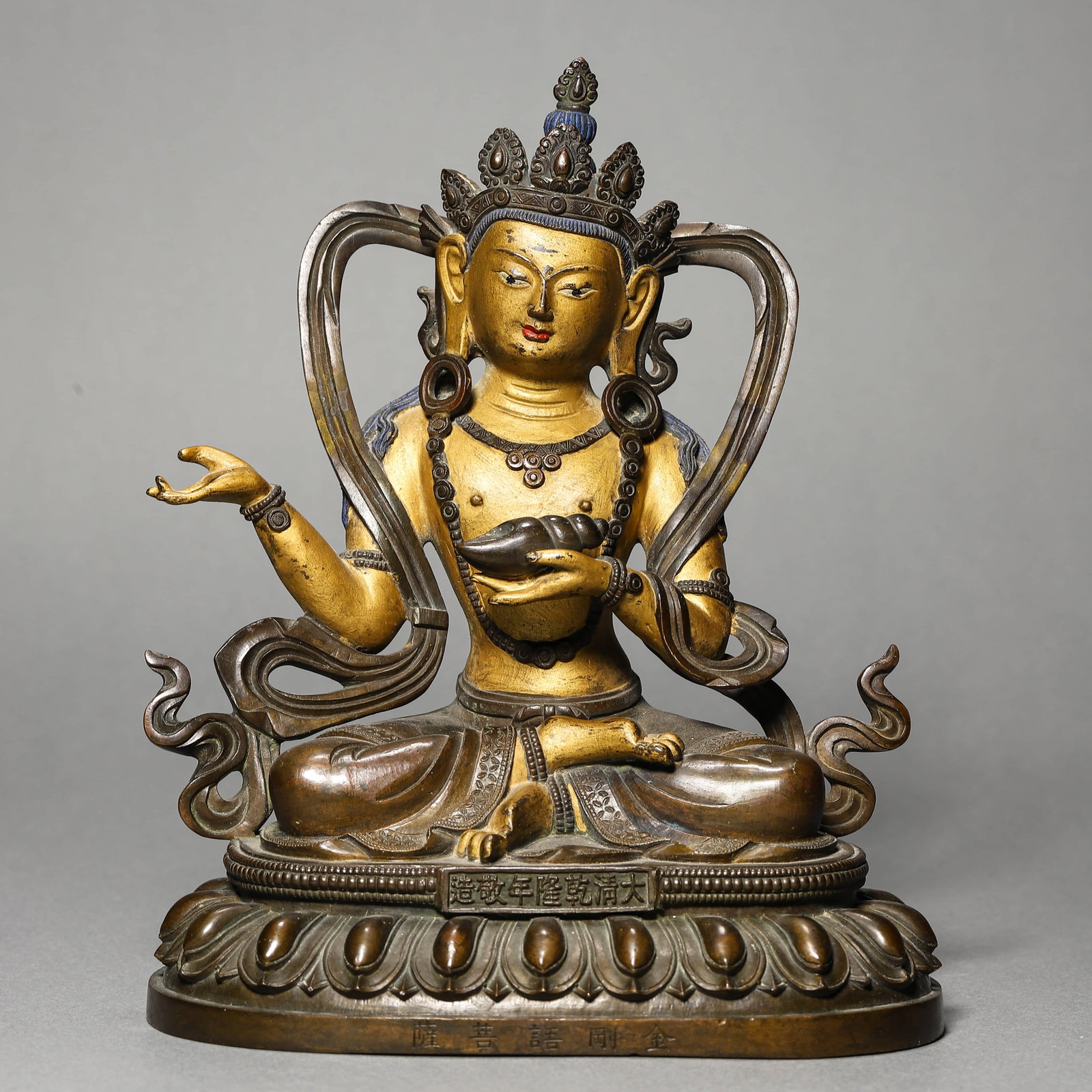 A GILT-BRONZE BUDDHA FIGURE: A GILT-BRONZE BUDDHA FIGURE Height: 6 15/16 in. (17.7 cm)