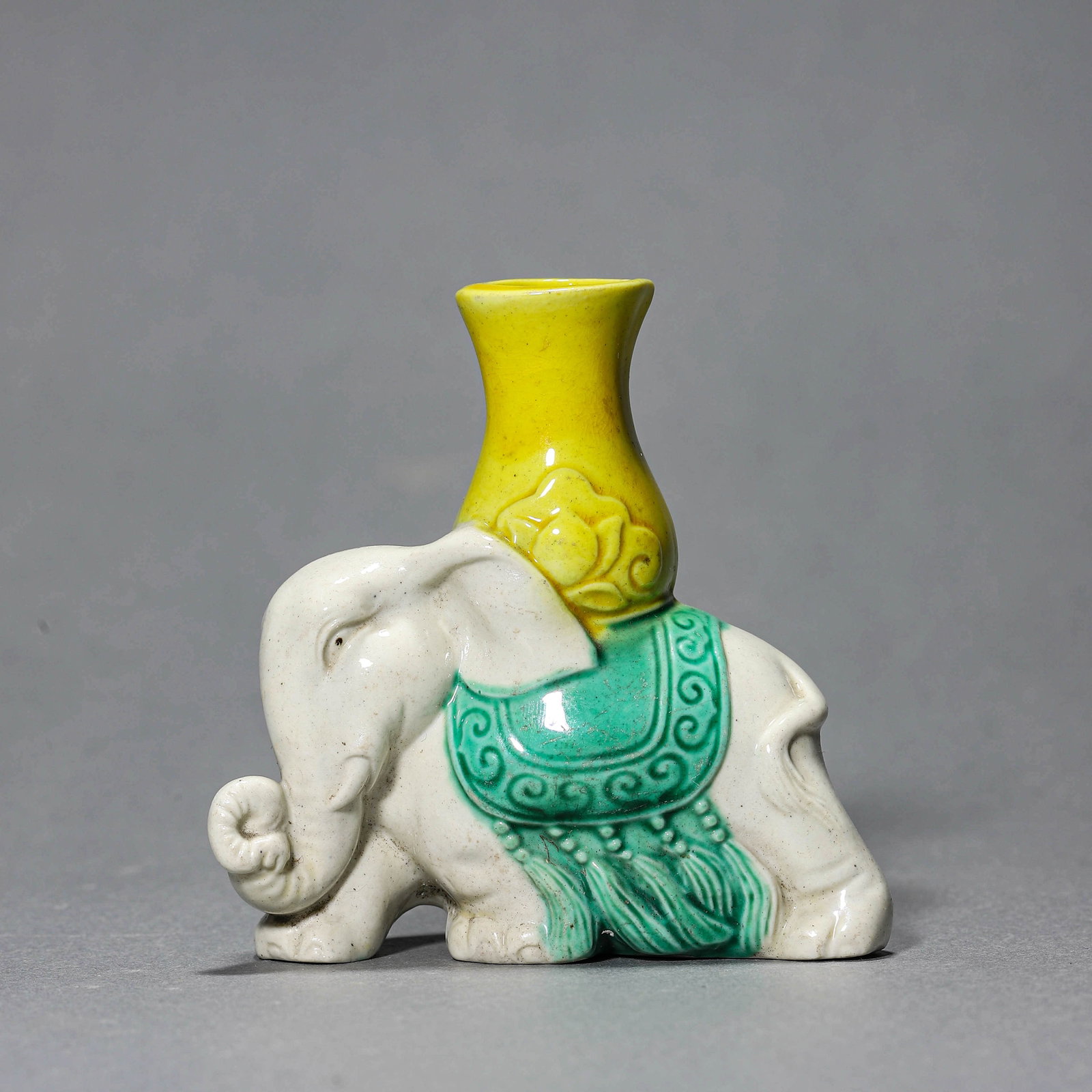 A SANCAI POTTERY 'TAIPING YOUXIANG' FIGURE: A SANCAI POTTERY 'TAIPING YOUXIANG' FIGURE Height: 3 1/8 in. (8 cm)